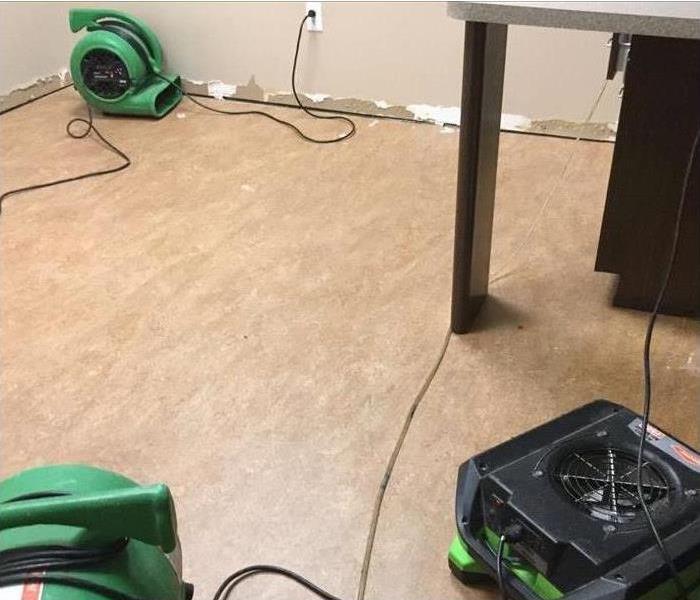 Specialized equipment used to dry water damage on floors and baseboards